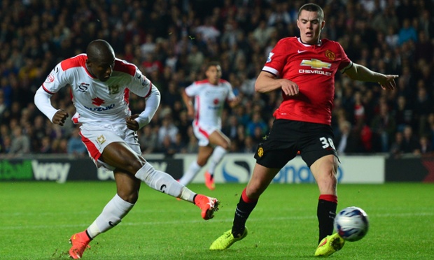 Benik Afobe comes on for two goal hero Grigg and in possibly his first touch of the game sweeps the ball past David de Gea to make it 3-0.