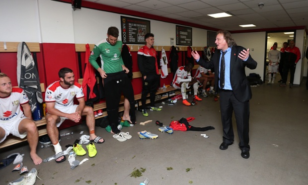 MK Dons Chairman Pete Winkelman celebrates with the players in the dressing room.