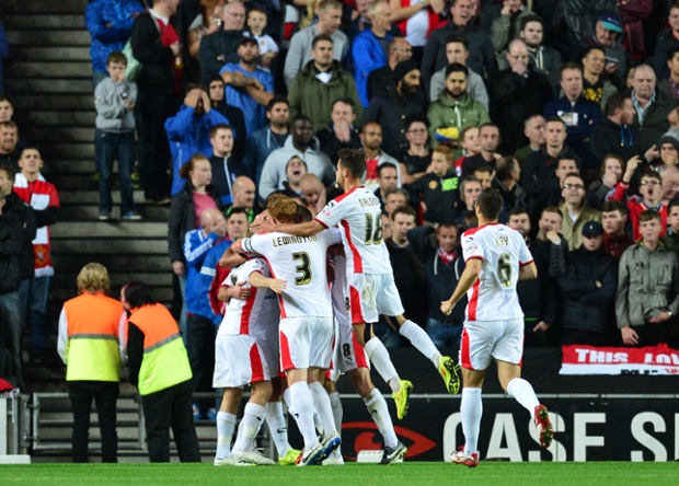 But then a United gaff gifts MK Dons the lead.  Jonny Evans miscues a pass to David De Gea, which Ben Reeves pounces on, before poking it into the path of his team-mate, William Grigg. He shoots into a gaping net from about seven yards out.