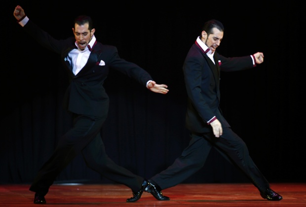 Twins Nicolas and German Filipeli from Argentina dance during the final round of the Tango World Championship in Stage style in Buenos Aires