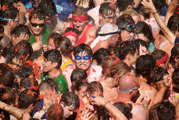 Revellers take part in La Tomatina