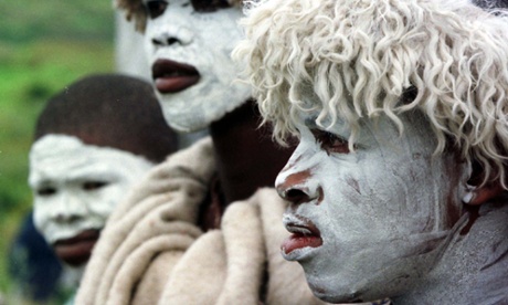 Abakhwetha, the Xhosa word for initiates, near the Eastern Cape Province town of East London, South Africa. With white clay covering their faces as a symbol of purity, they wear sheepskins to protect them from the cold, as they near the end of their ritual initiation into manhood.