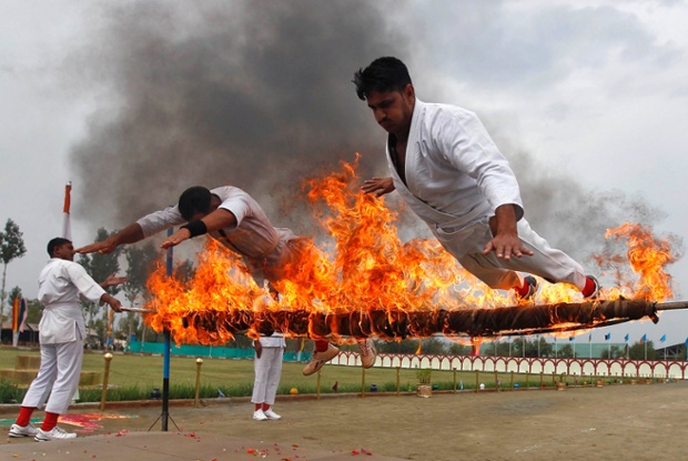 India’s central reserve police force perform a stunt during the passing out parade in Humhama, Srinagar