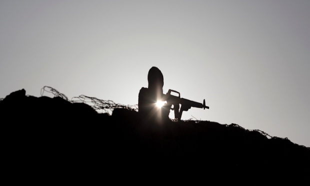 A metal board shaped like a gunman sits on an old bunker at an observation point on Mt Bental in the Israeli-controlled Golan Heights, overlooking the border with Syria