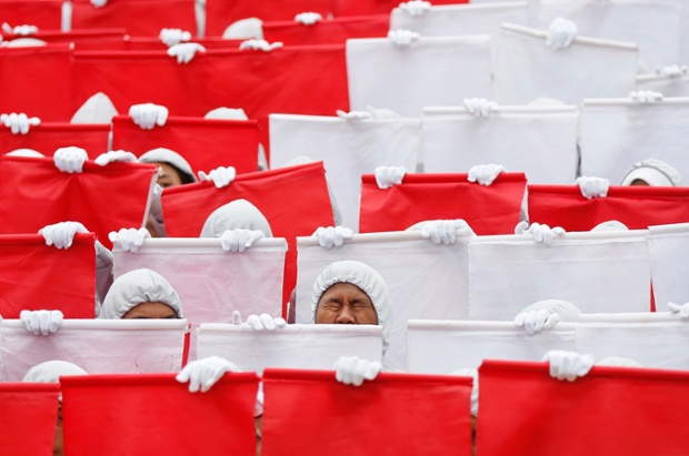 Volunteers practise for the upcoming independence day celebrations in Kuala Lumpur