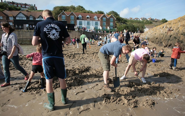Digging for gold - 30 individual pieces of gold have been buried under the sand of the beach in Folkestone harbour by artist Michael Sailstorfer