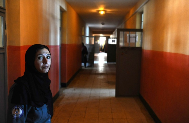An Afghan police officer looks on inside the facility.