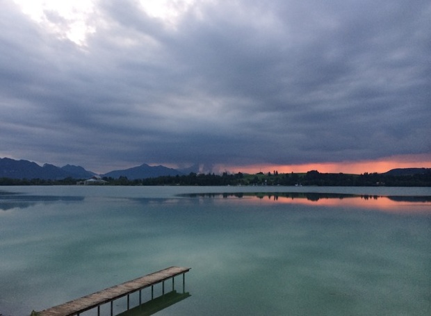 'Sunset over the Forggensee: The end of the sunset. The light turned the water of the lake an iridescent colour.'