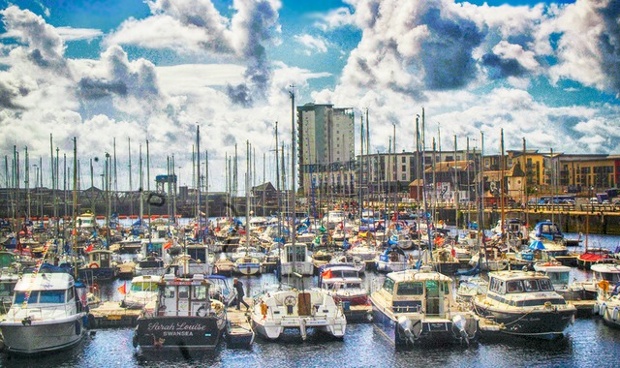 'Clouds gathering over Swansea Marina: I took this photo on Saturday before the storms hit. The boats were obviously staying safely moored!'