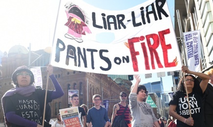 Demonstrators at the anti-government rally in Sydney on Sunday. Photograph: Paul Miller/AAP