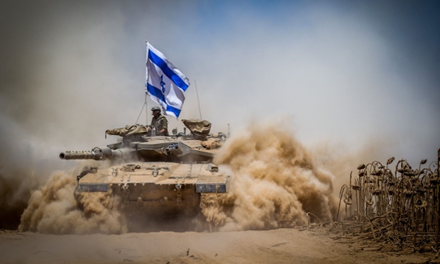 An Israeli Merkava tank pulls back from the Gaza Strip. The Israeli military has announced that it will hold fire for seven hours Monday in parts of the Gaza Strip to facilitate the entry of humanitarian aid and for displaced Palestinians to return to their homes.