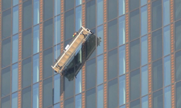 The maintainence ariel work platform hanging at an angle on the DC Tower after two window cleaners were trapped at 144 metres from the ground on the 48 floor in their platform at the front of the 'DC-Tower,' Austria's highest skyscraper, in Vienna, Austria, on 02 August 2014. The men were rescued by the Vienna fire brigade and were unhurt.