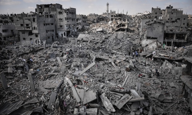 Palestinians inspect their destroyed homes in Shejaiya, Gaza which witnesses said was heavily hit by Israeli shelling and air strikes