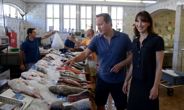 Prime Minister David Cameron and his wife Samantha as they visit a seafood market in Cascais in Portugal as they enjoy their family holiday.