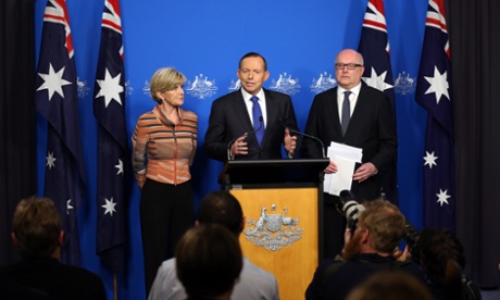 Tony Abbott at a joint press conference with foreign minister Julie Bishop and attorney general George Brandis.