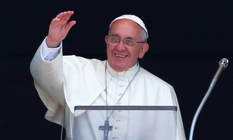 Pope Francis waves during a Sunday Angelus prayer in Saint Peter's square at the Vatican.