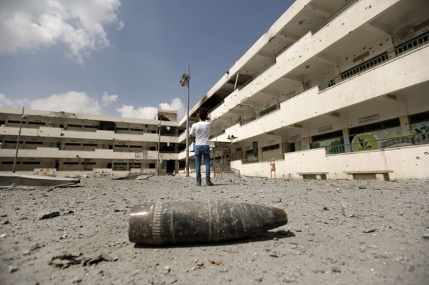 A shell lies on the ground near the heavily damaged Sobhi Abu Karsh school in Gaza City's Shujai'iya neighbourhood.