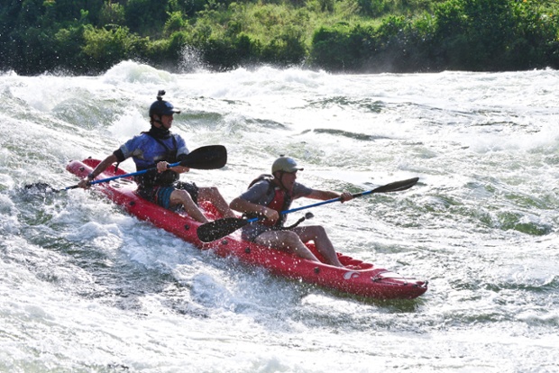 Sam Ward takes Lev kayaking down the white water rapids at the source of the Nile, Uganda.