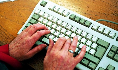 Older woman using a computer keyboard