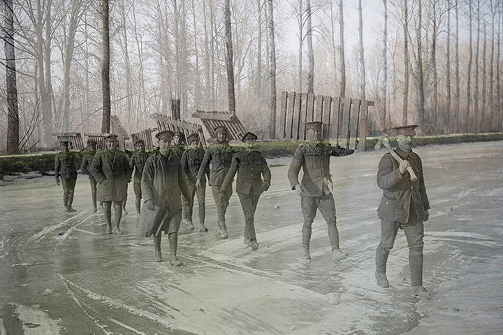 20 Photographs: Members of the Royal Garrison Artillery walk across the frozen Somme canal, 1917