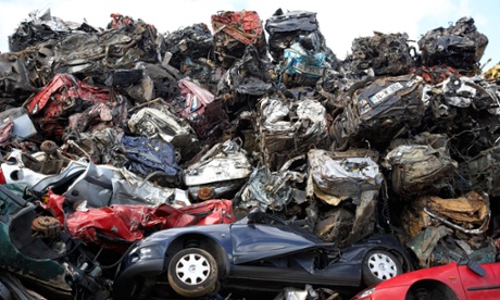 Piles of crushed cars at a metal recycling site in Belfast, Nor