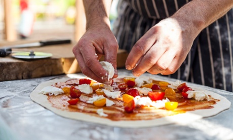 chef making pizza