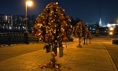 Love locks attached to metal trees on Moscow's Luzhkov Bridge.