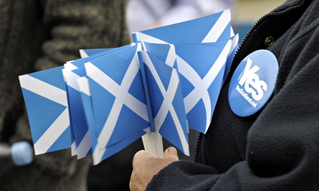 A pro-independence supporter holds campa