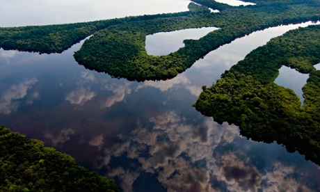 Clouds reflecting in a river in Amazon near Manaus, Brazil