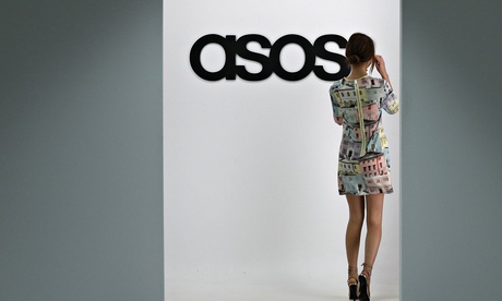 A model walks on an in-house catwalk at the Asos HQ, in London.