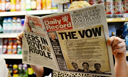 The three leaders of the UK's main political parties signed their funding pledge on the front page of the Daily Record newspaper. Photograph: Stefan Rousseau/PA