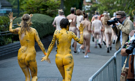 Streak for tigers … runners in body paint raise money for conservation at London zoo.
