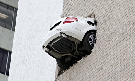 A Mercedes car after reversing through a 7th floor wall of a parking garage, Oklahoma