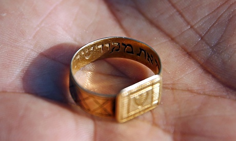 A golden ring inscribed in Hebrew unearthed at the Nazi death camp in Sobibor