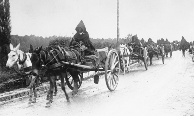 French Moroccan troops head to the front with supply wagons pulled by donkeys.