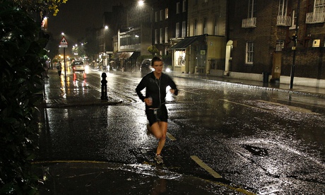 Runner in London street at night