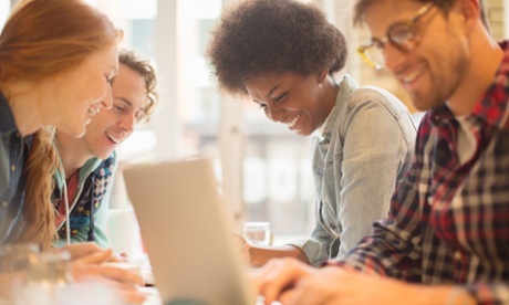 postgrad students on laptops