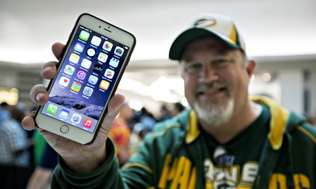 An iPhone 6 buyer shows off his new purchase