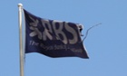 A flag flies above the head office of the Royal Bank of Scotland in St Andrew Square in Edinburgh.