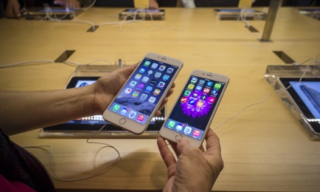 A customer in the Apple store in Grand Central Terminal in New York compares an iPhone 6 and a 6 Plus. Apple announced that it had sold 10 million units of its new phones over last weekend, and rebuffed claims that the phones are prone to bending in normal use.