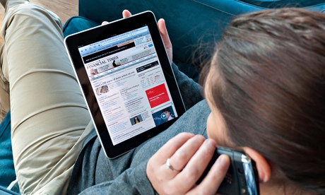 Woman reading Financial Times on iPad