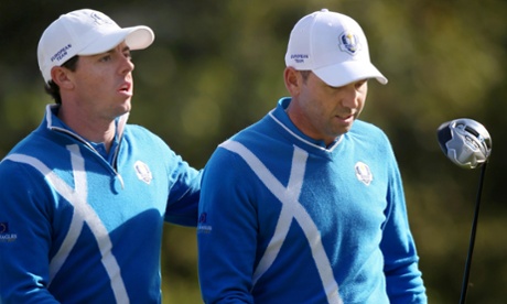 Europe's Rory McIlroy (L) and Europe's Sergio Garcia during the foursomes.