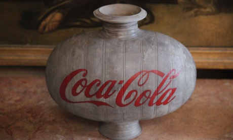 A Han dynasty vase with Coca-Cola logo seems to mock its surroundings.