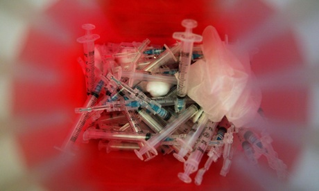 syringes in bio waste container