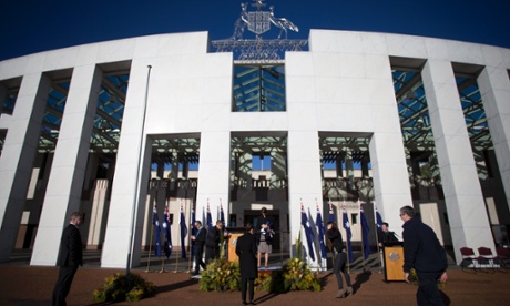 Parliamentary workers prepare for a ceremony  for National Flag day this morning on the forecourt of Parliament House.