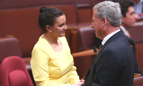 Tasmanian PUP senator Jacqui Lambie is congratulated by fellow Tasmanian, Liberal senator Richard Colbeck.
