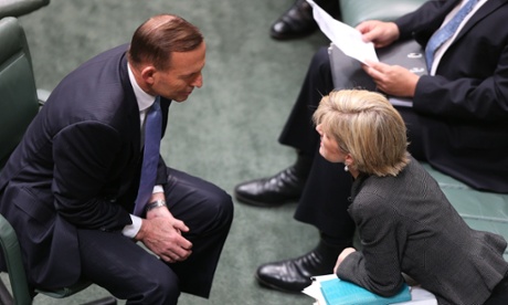 The Prime Minister Tony Abbott talks to the Foreign Minister Julie Bishop before for question time.