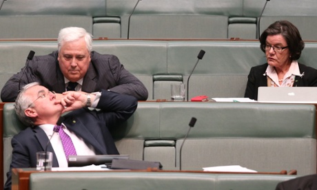 The Leader of the PUP party Clive palmer talks with Tasmanian Independent Andrew Wilkie while Cathy McGowan watches on.