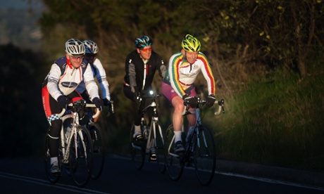 The Prime Minister Tony Abbott (yellow helmet) on his early morning bike ride this morning.