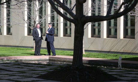 Finance minister Mathias Cormann and agriculture minister Barnaby Joyce chat outside the senate.